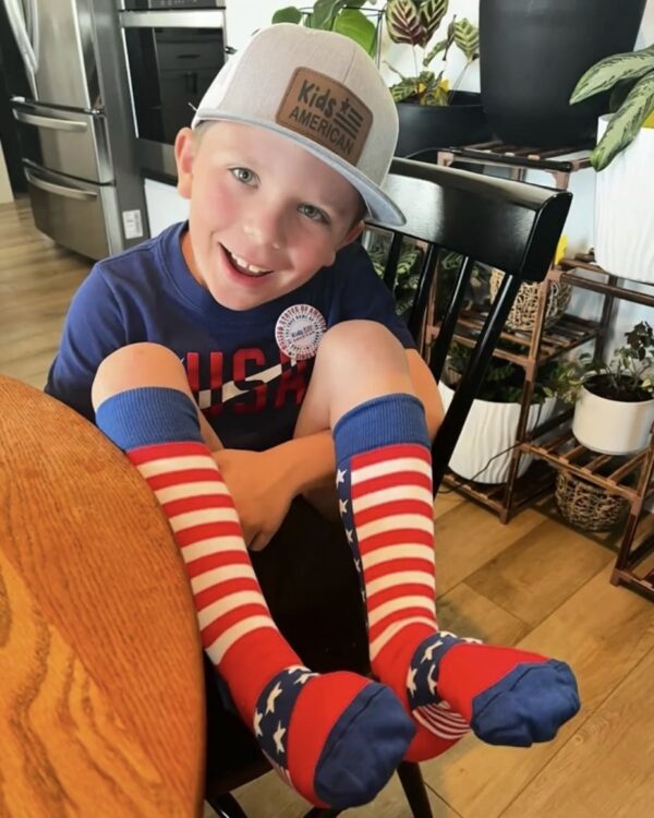 picture of boy wearing our red white and blue socks