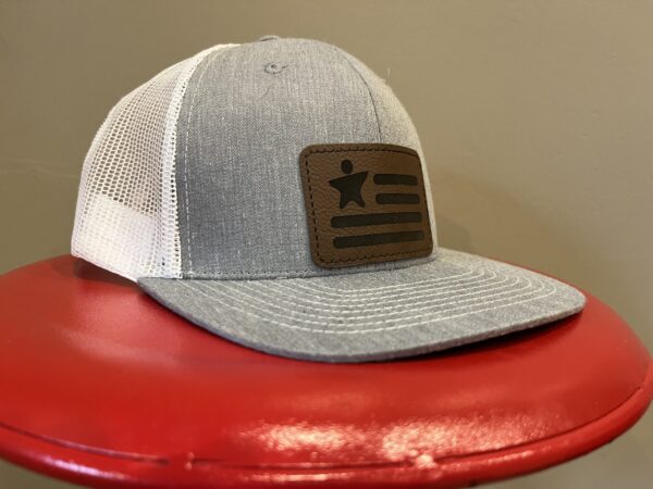 hat with logo on red stool